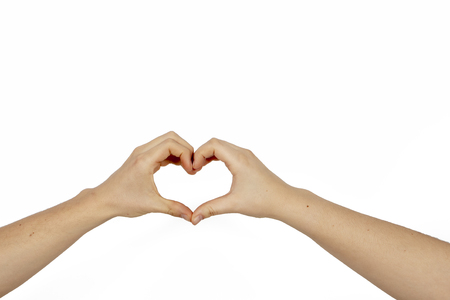 hands of man and woman formed as a heart as love symbolの写真素材