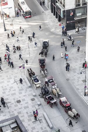 VieNNA, AUSTRIA - FEB 15, 2019: fiaker at stephans place in Vienna wait for tourists to have a carriage ride in the old town of Vienna, Austria. Fiaker licences is strictly limited in Vienna.のeditorial素材