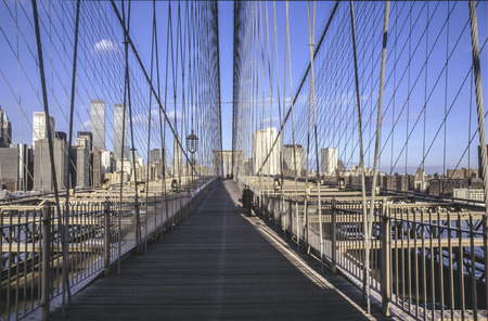 NEW YORK, USA - SEP 10, 1996: brooklyn bridge in New York with twin towers in background.のeditorial素材