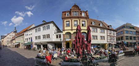 MARKTHEIDENFELD, GERMANY - MAR 30, 2019:  people enjoy a warm summer das at the historic central market place in Marktheidenfeld, Germany.のeditorial素材