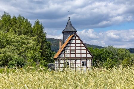 Neu Anspach, Germany - Jul 2, 2019: old timbered church at the Hessenpark Open-Air Museum in Neu Anspach.のeditorial素材
