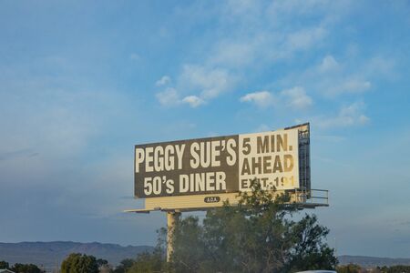 Yermo, USA - MAR 11, 2019: advertising for Peggs Sues diner in 5 miles, exit 191.のeditorial素材