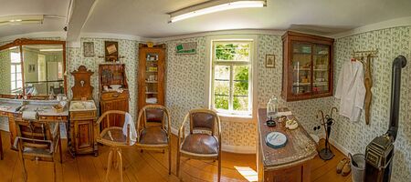 Anspach, Germany - July 2, 2019: old vintage hair dresser shop with chair and sink of a hair stylist of last century in the Hessenpark, Neu Anspach.のeditorial素材
