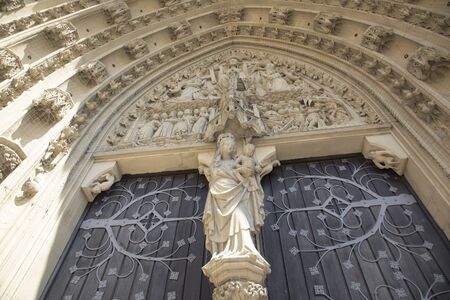 Wurzburg, Germany - July 16, 2019: The tympanum shows the Coronation of the Virgin portal of the Marienkapelle in Wurzburg, Bavaria, Germany.のeditorial素材