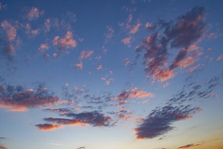 scenic dramatic cloud structure at sunset with blue sky