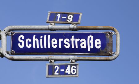 street sign schillerstrasse (Schiller street) in Frankfurt downtown under blue sky