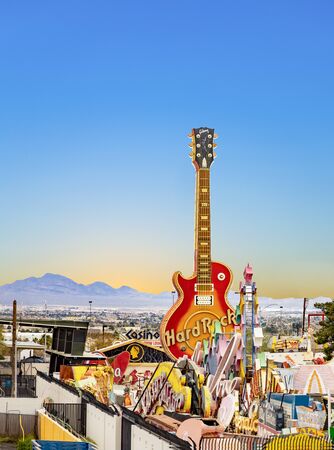 Las Vegas, USA - March 10, 2019: Vintage Hard Rock Cafe giant guitar sign seen at dusk in the Neon Museum open-air exhibit.のeditorial素材