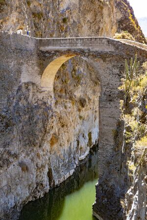 stone bridge over Colca Canyon in Peruの写真素材