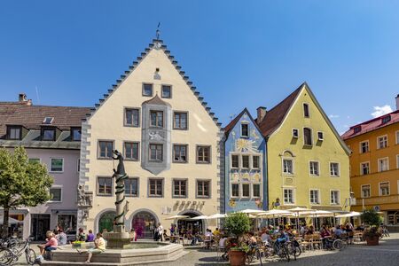 Fuessen, Germany - August 4, 2019: people enjoy visiting the central part of the historic town of Fuessen with the market place.のeditorial素材