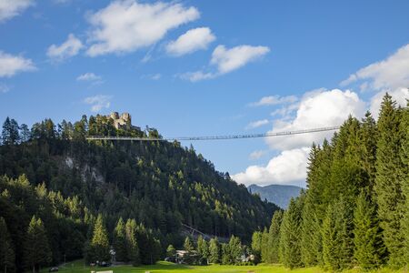 Reute, Austria - August 14, 2019: europes largest hanging bridge connects castle Ehrenberg with the other side of the valley in Reute.のeditorial素材