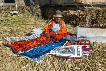 Lake Titicaca, Peru - August 2, 2019: Uros Tribe demonstrating life on the floating island at Lake Titicacaのeditorial素材