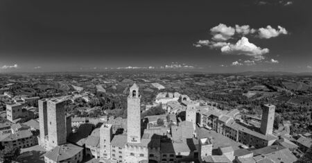 San Gimignano, old medieval typical Tuscan town with residential towers found therein in Italyの写真素材