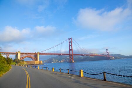 View of Golden Gate Bridge along the coastline in San Francisco with Point fort