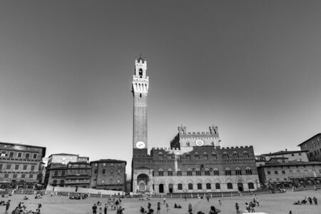 Siena, Italy - August 9, 2019: people visit famous piazza del campo  in Siena, Tuscany, Italy.のeditorial素材