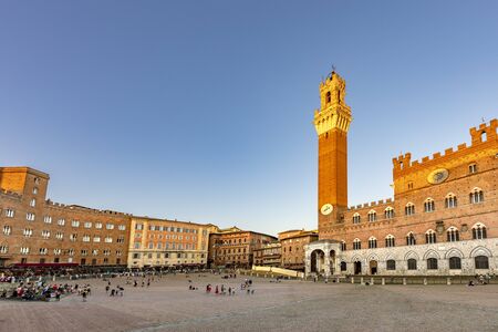 Siena, Italy - August 9, 2019: Palazzo Publico and Piazza del Campo in Siena. This historic center of Siena is a UNESCO World Heritage Site.のeditorial素材