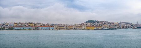 The view on Lisbon city, Portugal with river Tejo and the old town.の写真素材