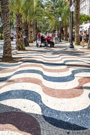 Alicante, Spain - September 23, 2019: people enjoy beautiful alley with palm trees - Explanada de Espana. Alicante. Spainのeditorial素材