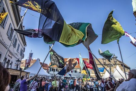 Gau-Algesheim, Germany -October 14, 2018:  people celebrate the flag swinging  at the Gau-Algesheim Wine festival.のeditorial素材