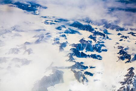 Aerial view of the antarctica with glaciers, mountain, snow and riverの写真素材
