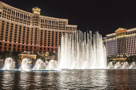 Las Vegas, USA - July 18, 2008:  Las Vegas Bellagio Hotel Casino, featured with its world famous fountain show, at night with fountains  in Las Vegas, Nevada.のeditorial素材