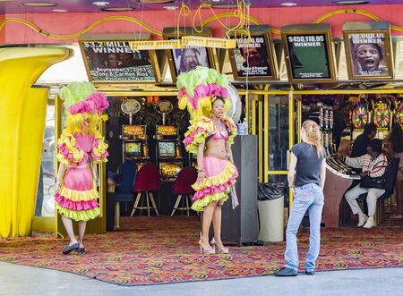 Las Vegas, USA - July 18, 2008:  bar girls try to get tourists by animation into the casino in Fremont street experience.のeditorial素材