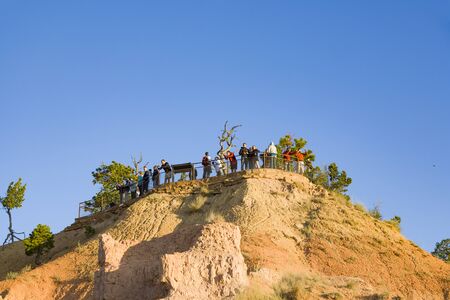 Bryce Canyon, USA - July 16, 2008: people watch the sunrise at beautiful Bryce Canyon with magnificent Stone formation like Amphitheater, temples and  figures.のeditorial素材