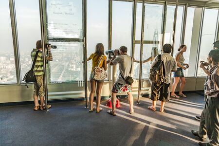 Bangkok, Thailand - January 2, 2010: people enjoying looking at   Bangkok skyline from the platform...