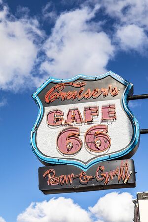 Golden Valley, USA - March 7, 2019: Route 66 neon sign for a bar and grill under clear blue sky in Golden valley.のeditorial素材
