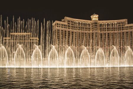Las Vegas, USA - July 17, 2008:  Las Vegas Bellagio Hotel Casino, featured with its world famous fountain show, at night with fountains  in Las Vegas, Nevada.のeditorial素材