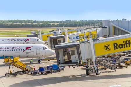 Vienna, Austria - July 23, 2009: aircrafts at boarding gate in vienna international airport Schwechart in vienna, Austria.のeditorial素材