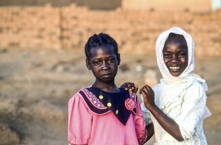 Omdurman, Sudan - November 2, 1989: girls pose for a photo in their best clothes in Omdourman near Khartoum, Sudan.のeditorial素材