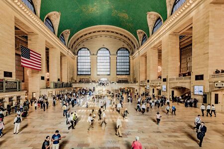 New York, USA - October 5, 2017: Commuters and tourists in the grand central station in New York, panoramic view. It is the largest train station in the world by number of platforms: 44のeditorial素材