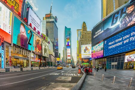 New York, USA - October 7, 2017:  neon advertising of News, brands and theaters at times square in late afternoon. Times square is a symbol for New York life and amusement.のeditorial素材