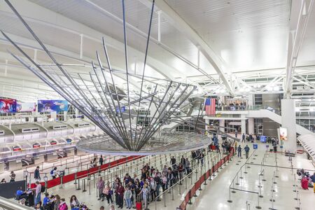 New York, USA - October 7, 2017: people ready for check in at Terminal 4 in JFK airport, New York. In 1963 the airport was rededicated John F. Kennedy International Airport.のeditorial素材