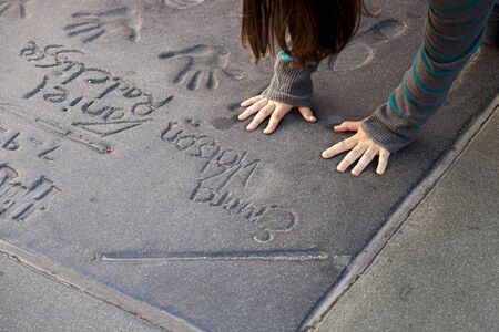 Los Angeles, USA - June 26, 2012: handprints of stars in Hollywood in the concrete of Chinese Theatre's forecourts.  There are nearly 200 celebrity handprints in the concrete of Chinese Theatre's forecourt.のeditorial素材