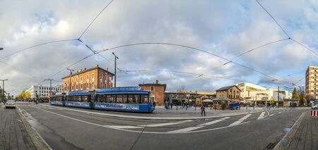MUNICH, GERMANY - NOV 12, 2016: skyline of Munich Pasing train station and street with people....