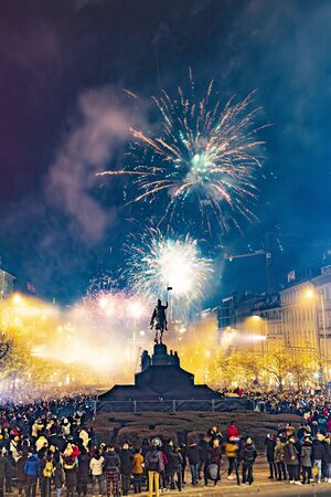 Prague, Czechia - January 1, 2010:  Large celebration of the New year 2019 on the main Prague square, the Wenceslas square. Hundreds of people were lunching fireworks and throwing firecrackersのeditorial素材