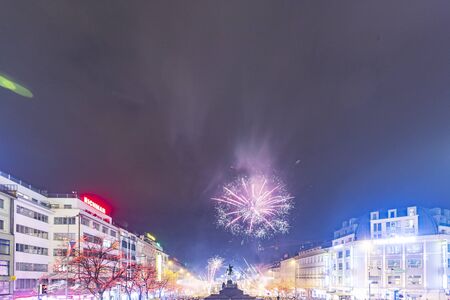 Prague, Czechia - January 1, 2010:  Large celebration of the New year 2019 on the main Prague square, the Wenceslas square. Hundreds of people were lunching fireworks and throwing firecrackersのeditorial素材