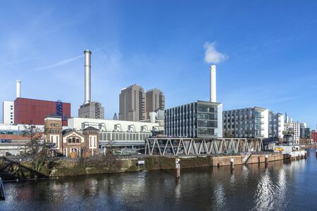 Frankfurt, Germany - Jan 11, 2020: view to coal fired power plant and historic pressurized water works at west harbor area in Frankfurt, Germany.のeditorial素材