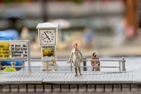 plastic man with dog waits at the train station in Bonn for the next train   at the scenic model lof the train stationの写真素材