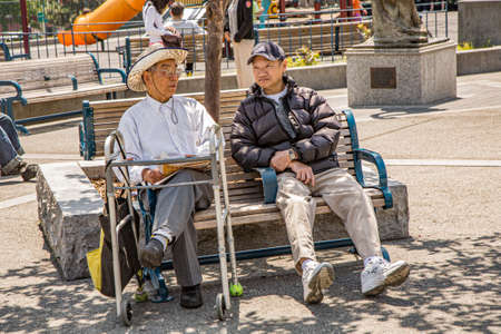 San Francisco, USA - July 24, 2008:  chinese men rest at midday at a park in CHinatown, San Francisco. San Francisco Chinatown is the largest Chinatown outside of Asia.のeditorial素材