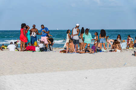 Miami, USA - August 30, 2014: people enjoy the famous south beach in Miami Beach and relax in afternoon sun.のeditorial素材