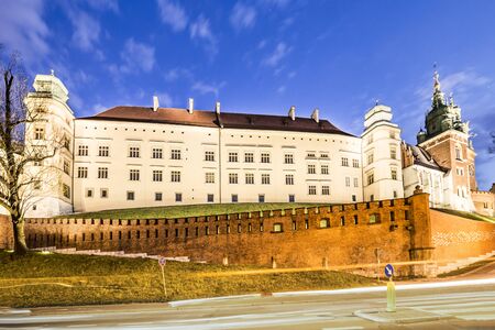 illuminated Wawel Hill by night in Cracow, Polandの写真素材