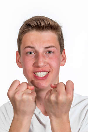 portrait of smiling happy  caucasian teenage boy in studioの写真素材