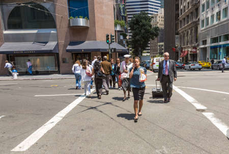 San Francisco, USA - July 24, 2008: people wait at a pedestrian crossing for green light to cross...