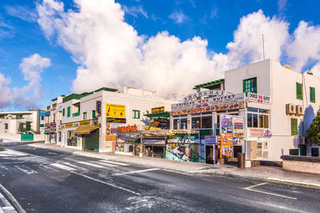 Playa Blanca, Spain - November 12, 2014: empty pedestrian shopping zone in playa Blanca, Lanzarote with closed shops.のeditorial素材