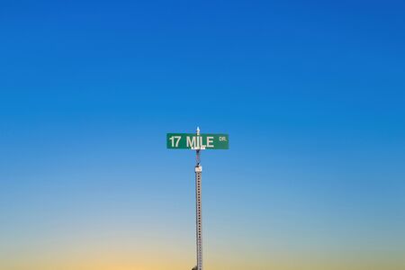 green street sign 17 Mile drive at  Pebble Beach near  Monterey in sunset light