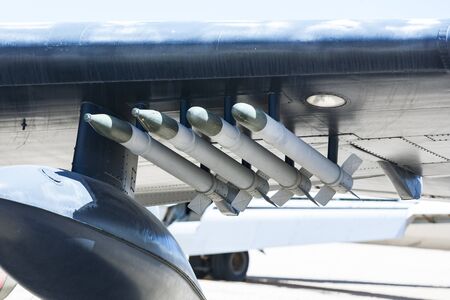old aircraft missiles at the wing of a fighter