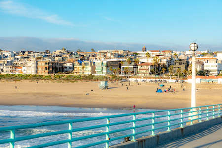 Manhattan Beach, USA - March 3, 2019: people enjoy the sunset at scenic beach and pier at Manhattan Beach near Los Angeles.のeditorial素材