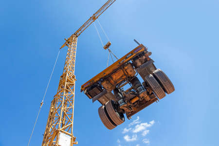 crane and transport axis under clear blue skyの写真素材